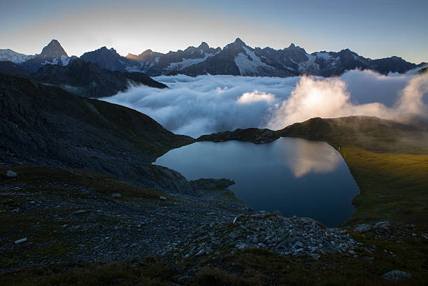 Sunset on Mont blanc and the surrounding mountains as I hiked along the trail to Lacs de Fenetre, the valley was filled with low cloud lit up by the final rays of the setting sun.