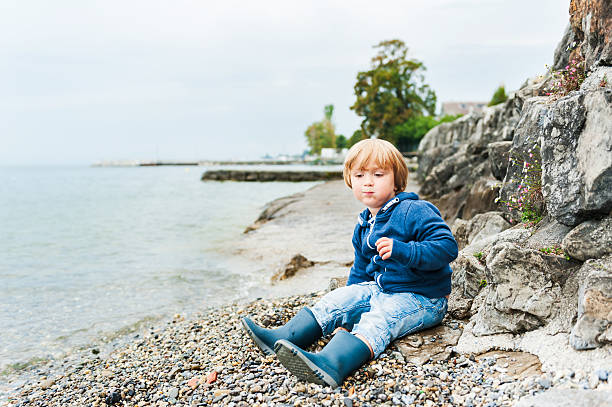 istock Cute toddler boy having fun outdoors 623868066