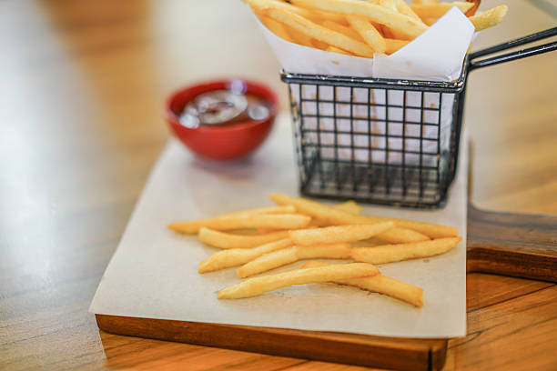 istock French fries on wooden table 623868240