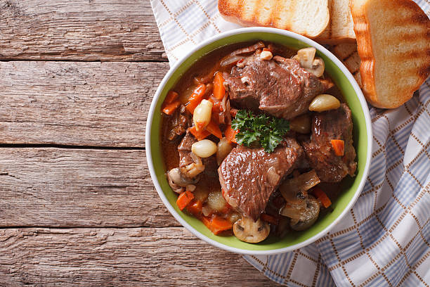 Homemade Beef Bourguignon in a bowl. horizontal top view Homemade Beef Bourguignon in a bowl on the table. horizontal view from above homemade food stock pictures, royalty-free photos & images