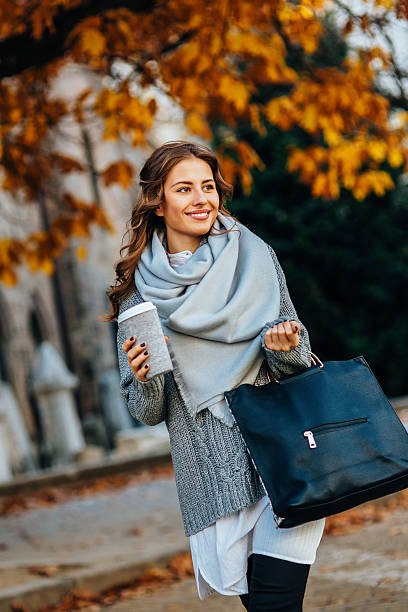 istock Woman drinking coffee outdoors 623879308