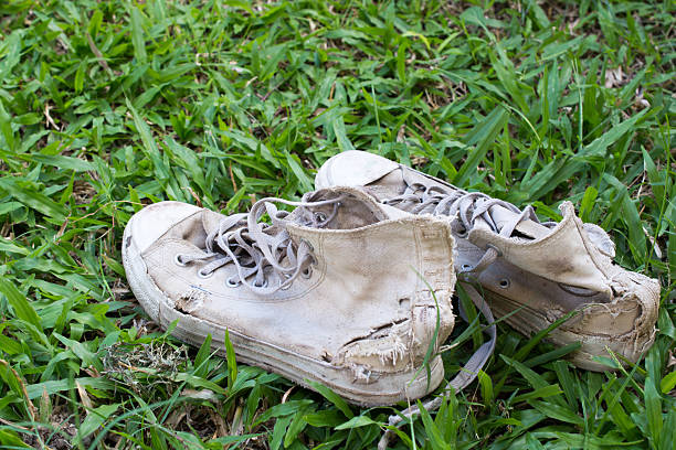 istock Lack old shoe lay on the grass green. 623880174