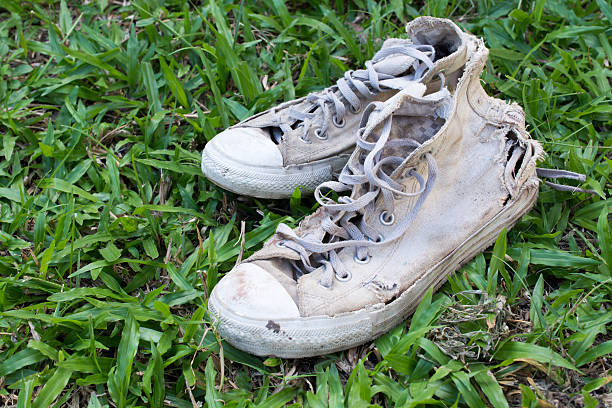 istock Lack old shoe lay on the grass green. 623880368