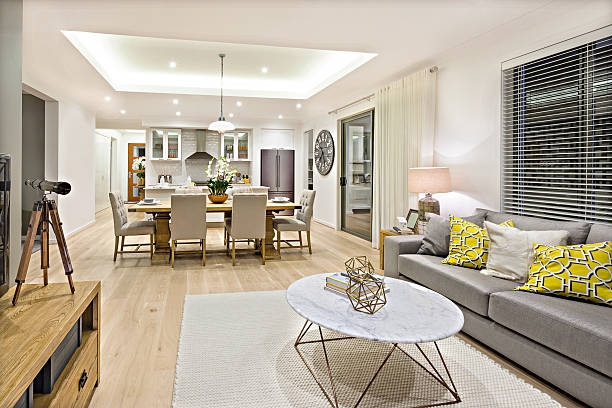 istock Modern living room including sofas and tables beside kitchen 623882570