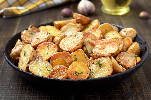 istock Fried potatoes in a frying pan 623884738