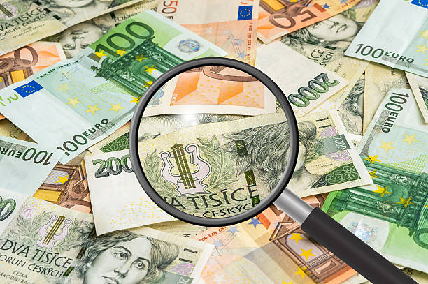 istock Czech and euro money background with magnifying glass 623885368
