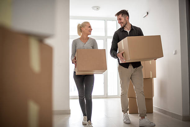 istock Couple moving into new apartment building 623886196