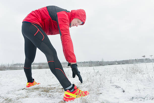 istock Active man during outdoor winter training session in snowy field 623886682