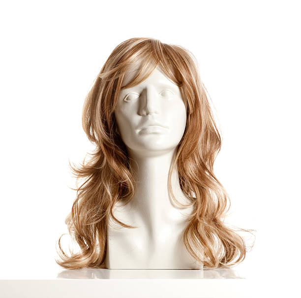 Variety of natural wigs and hairpieces on stand in specialized store