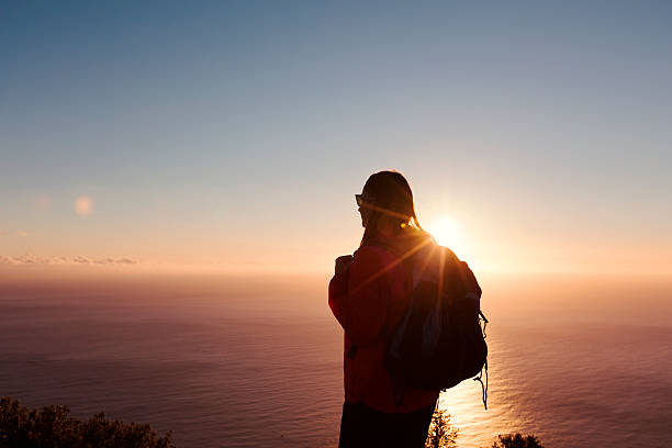 istock Hiker at mountain peak looking the ocean view 623896918