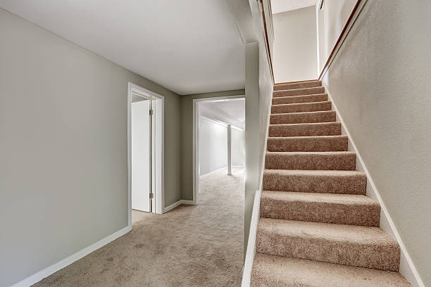 Empty hallway interior with gray walls and staircase. stock photo