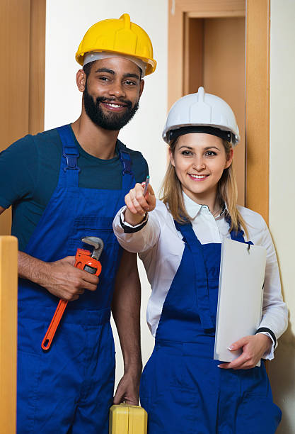 istock Successful cheerful team of builders standing 623899552