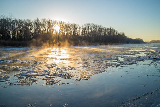 istock Sunrise during freeze-up in the river 623900088