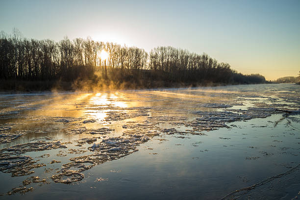 istock Sunrise during freeze-up in the river 623900142