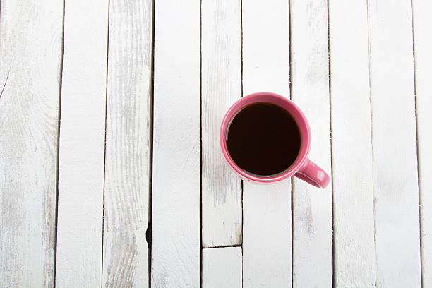 istock coffee cup white vintage wooden background 623900916