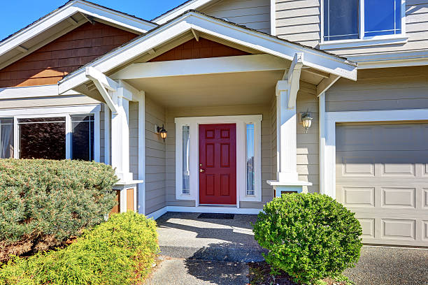 istock Entrance porch with red front door 623906254