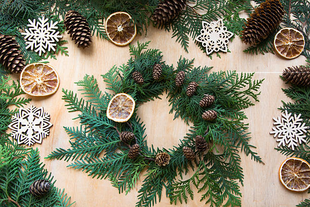 istock Christmas composition of wreath, cone, orange and snowflakes. Top view. 623906596