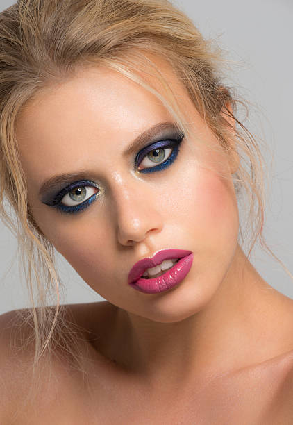 istock Girl with blue makeup 623907104