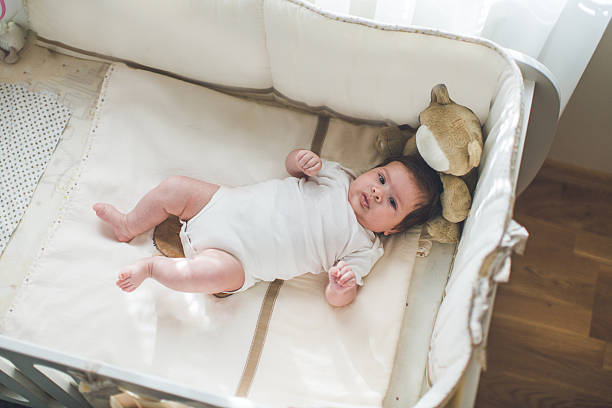 istock Baby in the crib 623907198
