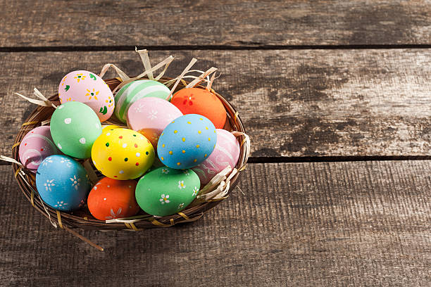 istock Easter eggs in nest on wooden background 623908622