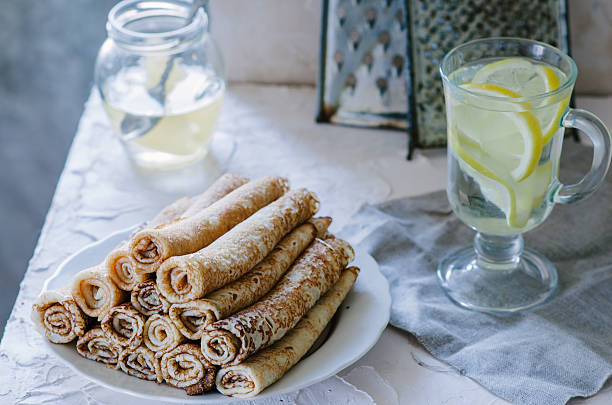 istock Crepe with lemonade and jam on white table 623910566