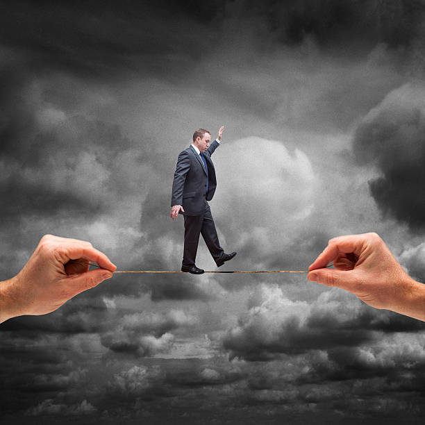 istock Businessman on Tightrope 623910684