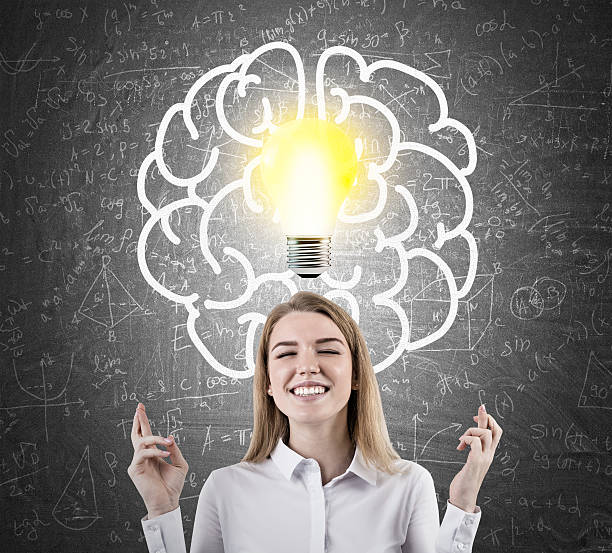 istock Woman with crossed fingers and light bulb 623911256