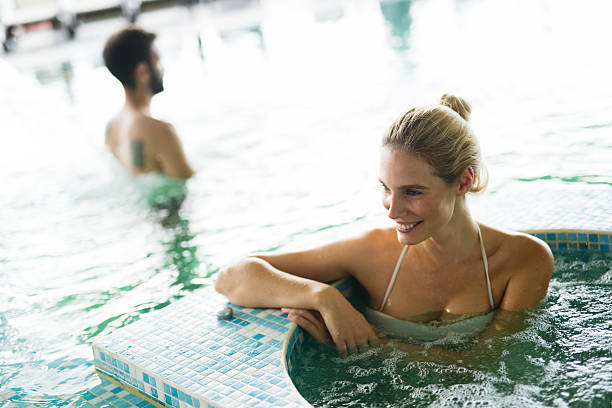 istock Beautiful woman in spa pool 623913488