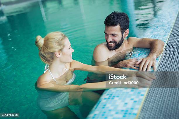 Romantic Couple Enjoying Thermal Bath Stock Photo - Download Image Now - Hot Spring, Swimming Pool, Couple - Relationship