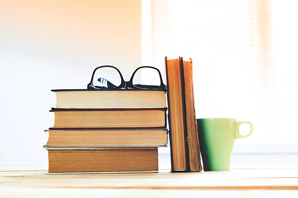 istock reading glasses with books on the table 623919834