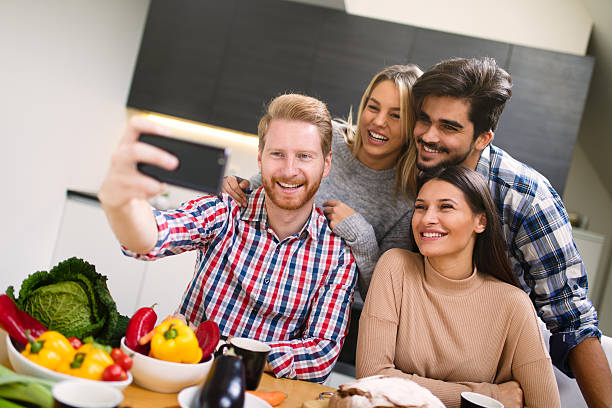 istock Group of friends taking a Selfie in the kitchen 623920448