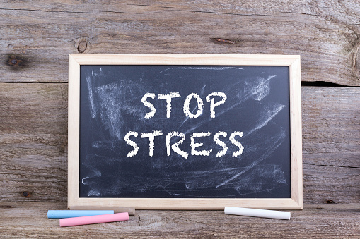 Stop Stress. Old wooden background with texture and chalk blackboard