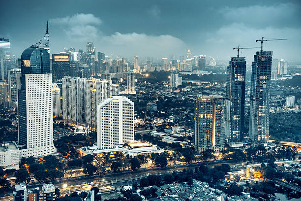 Jakarta skyline at dusk Jakarta skyline at dusk jakarta skyline stock pictures, royalty-free photos & images