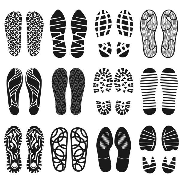 The collection of a shoeprints. Shoes silhouette black and white The collection of a shoeprints. Shoes silhouette black and white icons. Imprint of the soles with the differing patterns. Vector eps10 sole of shoe stock illustrations