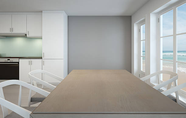 istock Sea view dining room and kitchen in luxury beach house 623922552