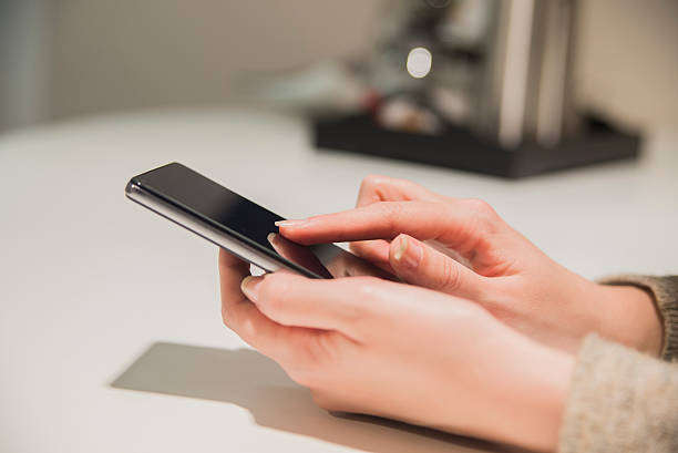 istock Close up, woman hand holding a smartphone and texting 623922698