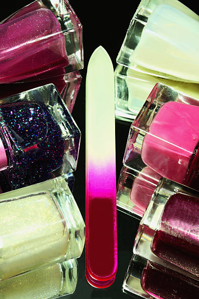 istock Nail polishes, nail file and their reflection in the surface 623926234