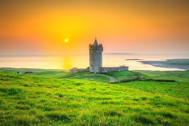 Beautiful irish castle near Atlantic ocean at sunset, Co. Clare Beautiful irish castle near Atlantic ocean at sunset, Co. Clare doolin photos stock pictures, royalty-free photos & images