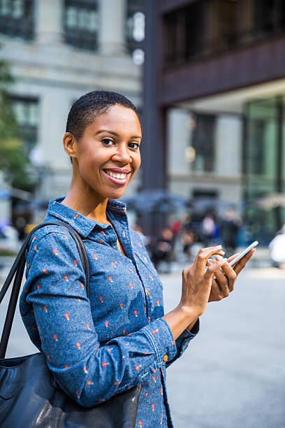 istock Woman texting in the streets in Chicago 623930038