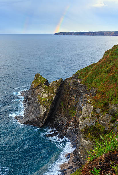 istock Colorful rainbow over sea coast. 623930236