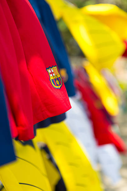 Santa Marta, Colombia - January 23, 2014: Closeup of FC Barcelona logo on red t-shirt with many other colored t-shirts. Santa Marta. Colombia 2015