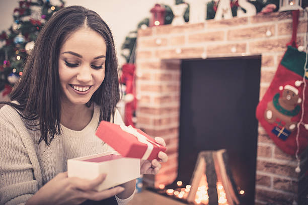 istock Woman with a Christmas Gift 623937706
