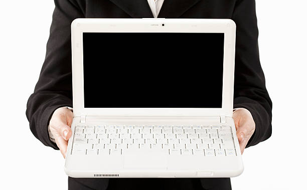 istock Businesswoman holding laptop computer 623939378