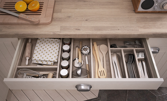 Kitchen tools in an open drawer