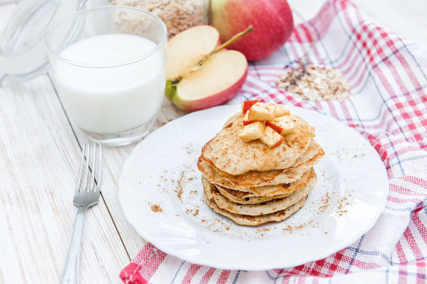 istock Oatmeal pancakes with apple and honey. 623942016