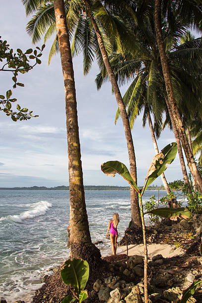 istock Women underneath the coconut palm 623942300