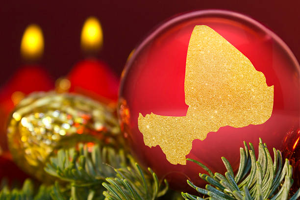 istock Red bauble with the golden shape of Mali.(series) 623942834