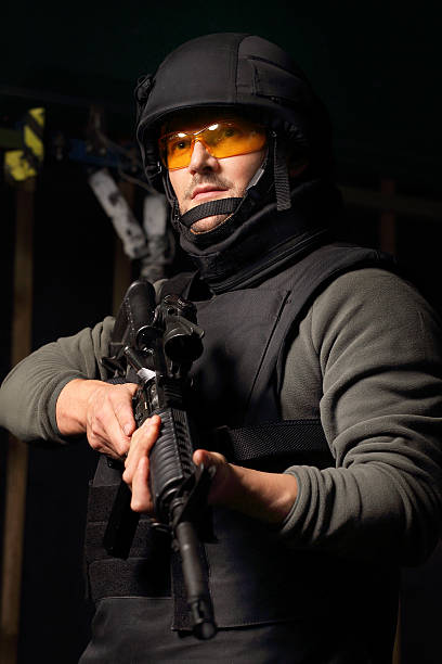 istock Antiterrorist. The man with a gun. 623943158