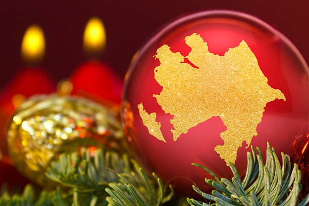 istock Red bauble with the golden shape of Azerbaijan.(series) 623952944