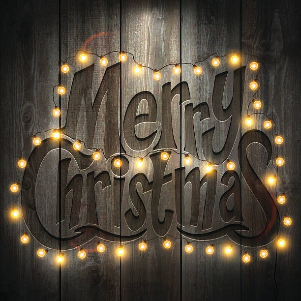 istock Merry Christmas Background with Christmas lights, on wooden Wall 623954336